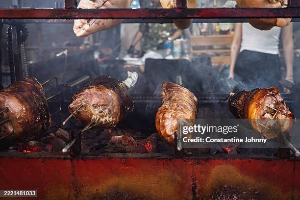 roasted pork legs grilling - assado no espeto imagens e fotografias de stock