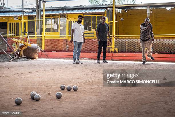 Club members play a match of petanque at the Club des Cheminots in Addis Ababa, on June 21, 2025. Petanque, or boules, is more readily associated...