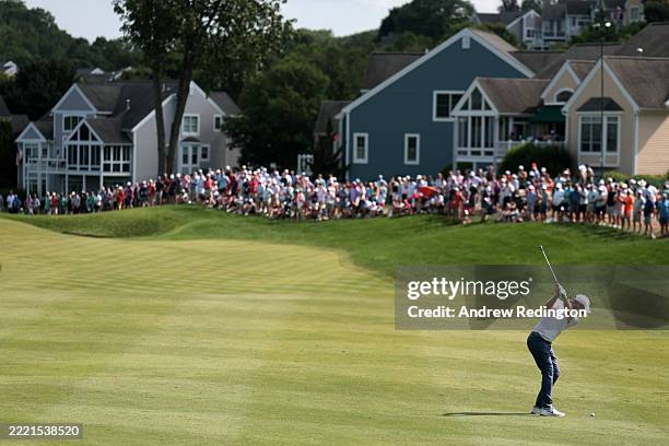 Tommy Fleetwood of England plays a second shot on the 12th hole during the final round of the Travelers Championship 2025 at TPC River Highlands on...