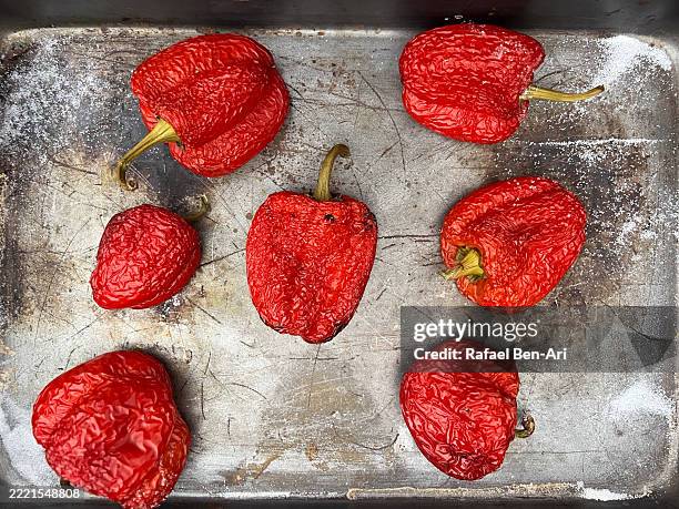 baked red bell peppers - roasted red pepper stock pictures, royalty-free photos & images