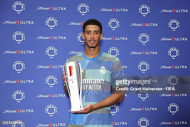 Jude Bellingham of Real Madrid C. F. Poses for a photo with the 2025 Superior Player of the Match trophy following the FIFA Club World Cup 2025 group...