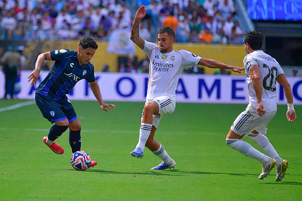Adrian Sanchez of Pachuca and Dani Ceballos of Real Madrid compete for the ball during the FIFA Club World Cup 2025 group H match between Real Madrid...