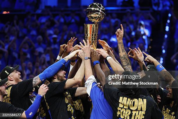 The Oklahoma City Thunder celebrate with the Larry O'Brien Championship Trophy after defeating the Indiana Pacers 103-91 in Game Seven of the 2025...