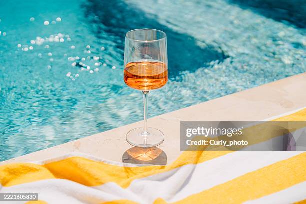 spritz cocktail on poolside. summer party. - poolside stock pictures, royalty-free photos & images