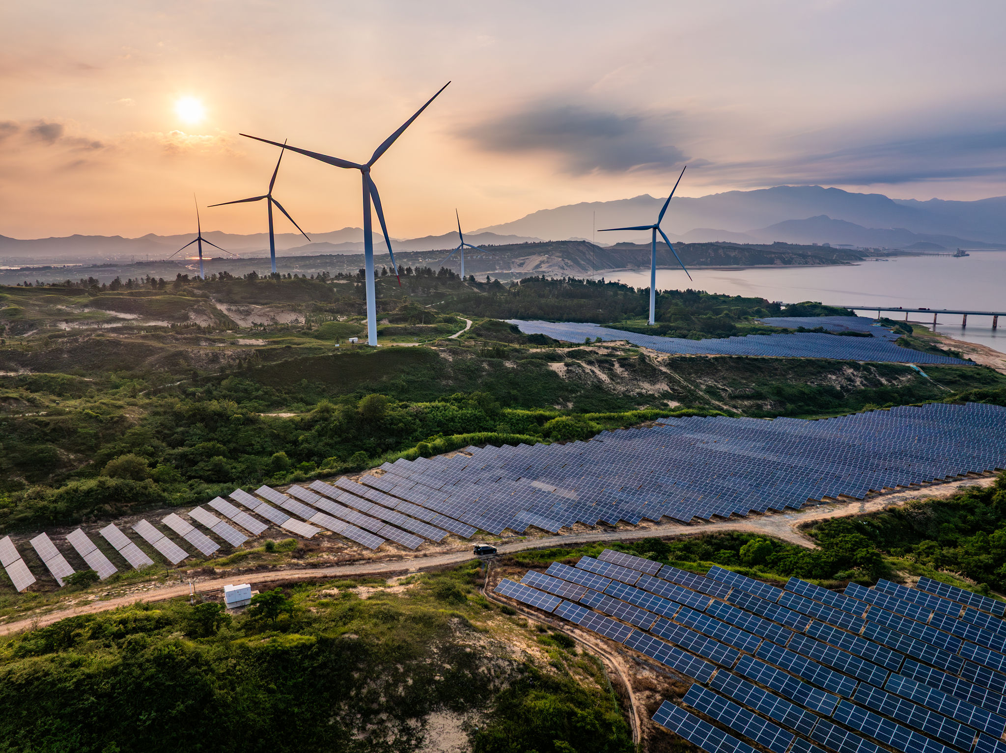 Photovoltaic solar energy wind power new energy at sunset Photovoltaic solar energy wind power new energy at sunset