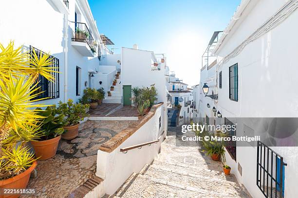 charming street in the the cozy old town of frigiliana, spain - andalucia stock pictures, royalty-free photos & images