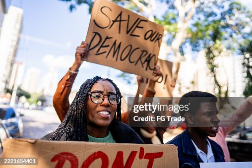 Young woman protesting outdoors Young woman protesting outdoors