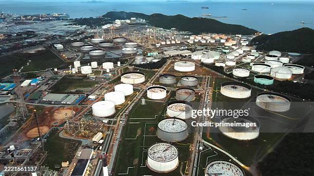 drone shot high angle oil refinery terminal and industrial facility for storage of oil and petrochemical. oil manufacturing products. power electric plant - gas tank stock pictures, royalty-free photos & images