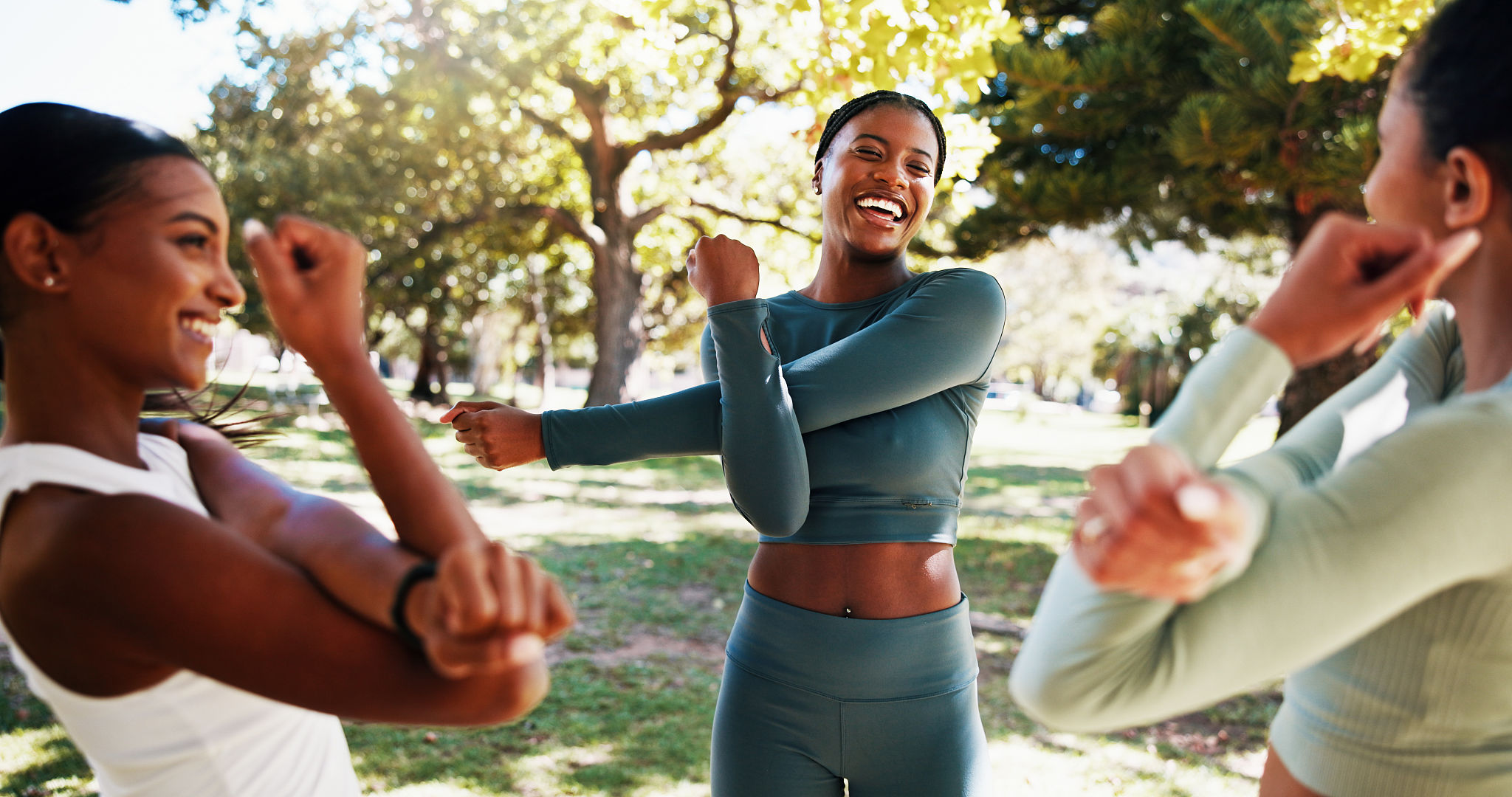 Park, laugh and women stretching outdoor with friendship, talking or wellness exercise. Sport, fitness and group of female athletes with arm warm up for health activity with conversation in nature Park, laugh and women stretching outdoor with friendship, talking or wellness exercise. Sport, fitness and group of female athletes with arm warm up for health activity with conversation in nature