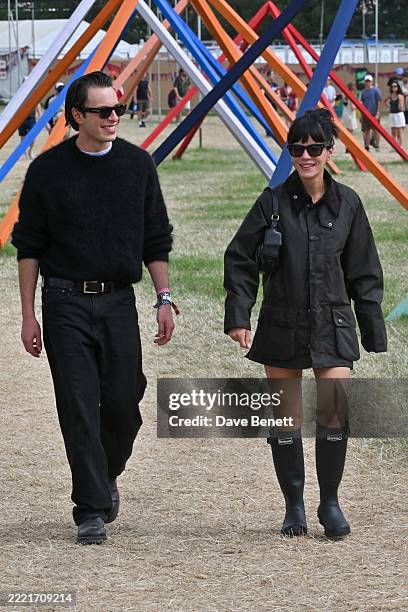 Marco Capaldo and Lily Allen are seen on day two of the Glastonbury Festival 2025 wearing iconic British heritage brand Barbour on June 28, 2025 in...