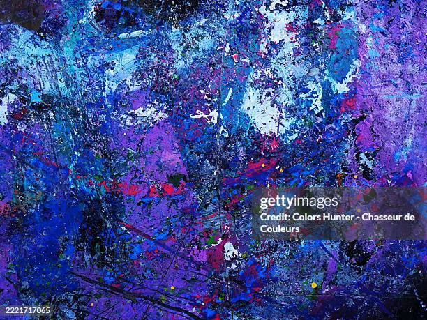 close-up of scratched and textured purple, blue and red layers of paint on a black canvas.
sunlight. natural colors.
brussels, belgium. - oil pastel drawing stock pictures, royalty-free photos & images
