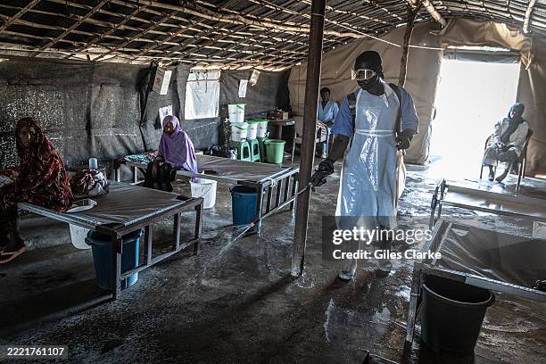 The MSF Cholera Clinic Minaa El Bari IDP Site is cleaned on January 19,2025 in Gedaref, Sudan. In August of 2024, the Minaa El Bari IDP Site, which...