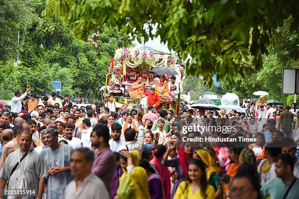 Devotees pull chariot of Lord Jagannath, Lord Balabhadra and Goddess Subhadra during the annual Ratha Yatra of Lord Jaganath at Iskcon temple...