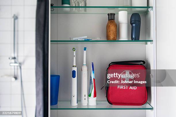 first aid kit with bathroom supplies kept in shelf - first aid stock pictures, royalty-free photos & images