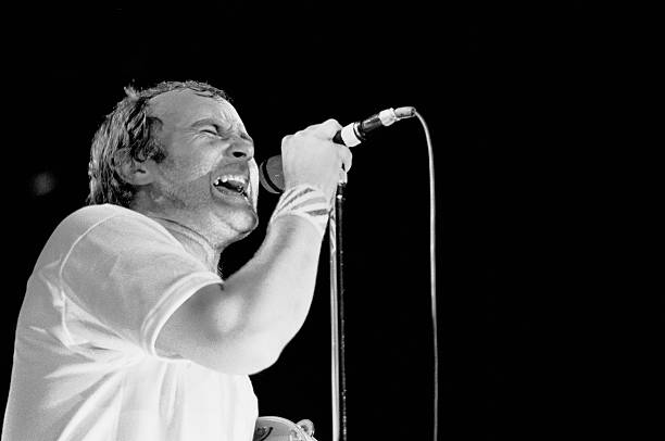 British Rock musician Phil Collins, of the group Genesis, performs during the 'Three Sides Live' tour, onstage at Forest Hills Stadium, Forest Hills,...