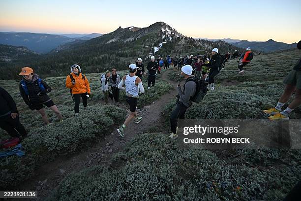 Competitor Rob Molke of US traverses Emigrant Pass in the first five miles of the 100-mile Western States Endurance Run, on June 28, 2025 in Olympic...