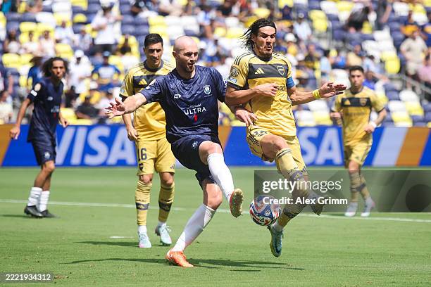 Christian Gray of Auckland City FC battles for possession with Edinson Cavani of CA Boca Juniors during the FIFA Club World Cup 2025 group C match...