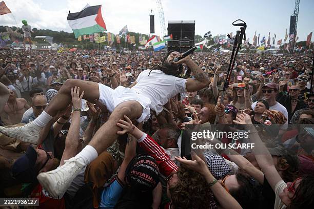Bobby Vylan of British duo Bob Vylan crowd surfing while performing on the West Holts Stage on the fourth day of the Glastonbury festival at Worthy...