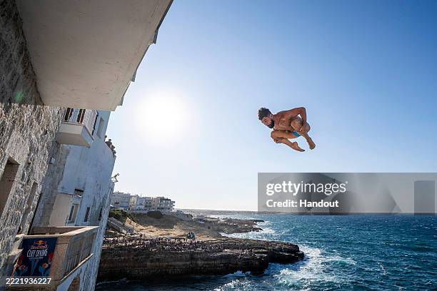 In this handout image provided by Red Bull, Carlos Gimeno of Spain dives from the 26 metre balcony during the first competition day of the second...