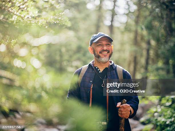 mature man hiking in the wilderness - solo travel stock pictures, royalty-free photos & images