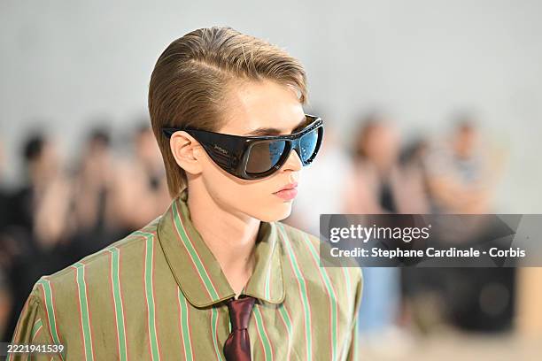 Detail of sunglasses, A model walks the runway during the Saint Laurent Menswear Spring/Summer 2026 show as part of Paris Fashion Week on June 24,...
