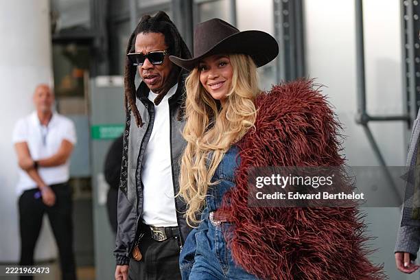 Jay-Z wears a black leather jacket with Louis Vuitton monogram logo print, a white t-shirt ; Beyoncé Knowles / Beyonce wears a cowboy hat, a burgundy...