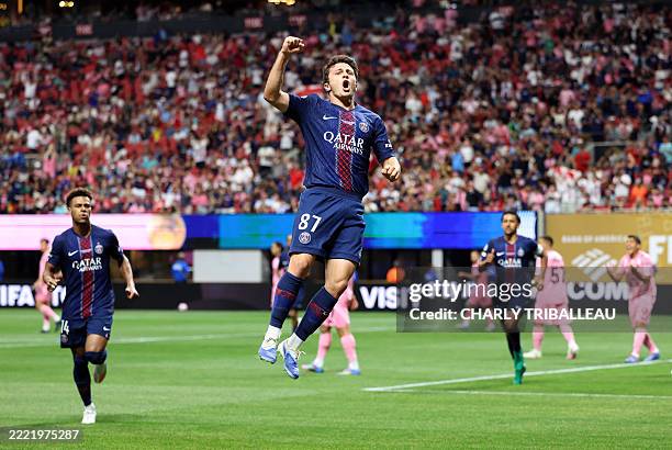 Paris Saint-Germain's Portuguese midfielder Joao Pedro Goncalves Neves celebrates after scoring the opening goal during the FIFA Club World Cup 2025...
