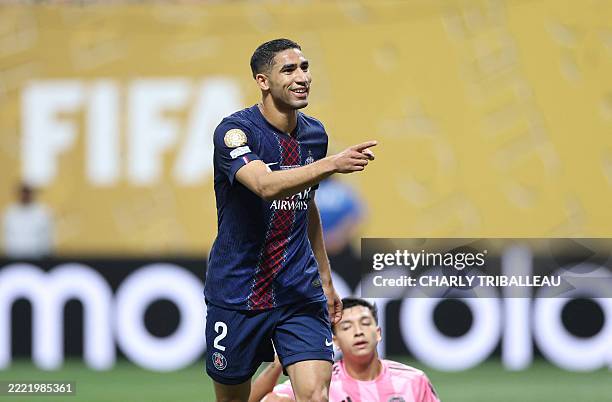 Paris Saint-Germain's Moroccan defender Achraf Hakimi celebrates after scoring his team's fourth goal during the FIFA Club World Cup 2025 round of 16...