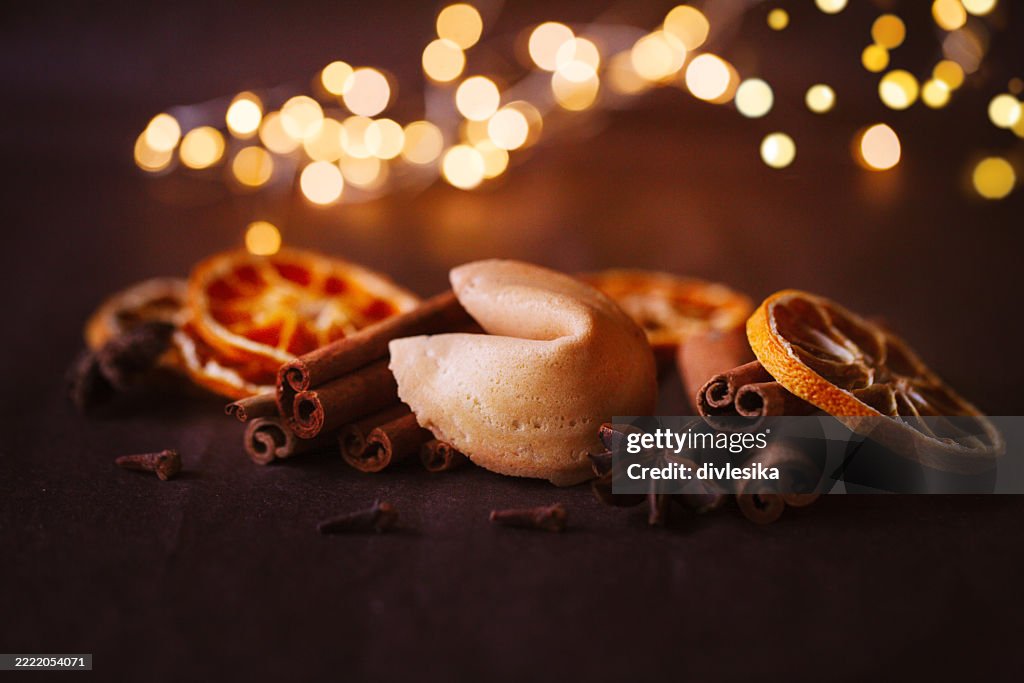 Dark chocolate with raspberries and mint on gray background