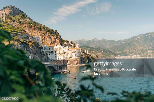 atrani, amalfi coast, italy. boats, and clear blue sea - costiera amalfitana foto e immagini stock