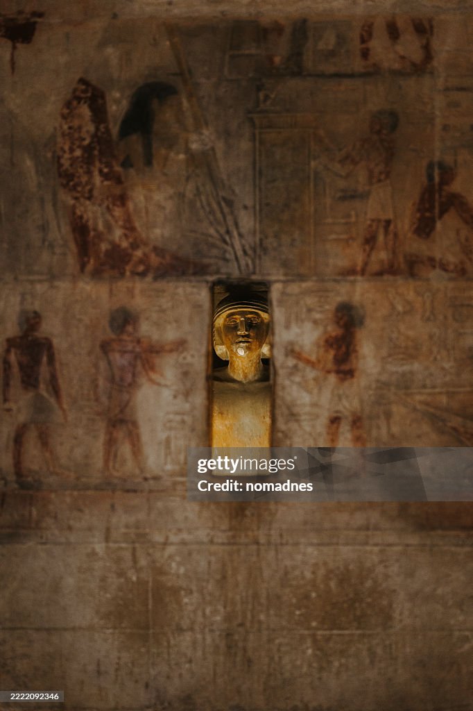 Hieroglyphic and Statue inside the Ancient Egyptian Tomb at Saqqara, Egypt.