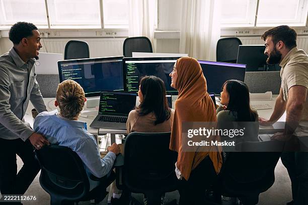 high angle view of happy computer programmers at tech startup office - developer code stock pictures, royalty-free photos & images