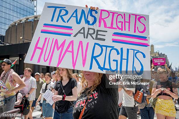Participant seen holding a sign at the march. Thousands of New Yorkers took to the streets of Manhattan to participate on the Reclaim Pride...