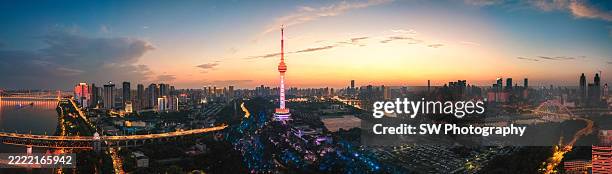 drone panorama photo of wuhan tv tower and cityscape at dusk - han river stock pictures, royalty-free photos & images