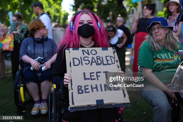 Disability Rights Are Human Rights Protest Sign People take part in a protest against disability welfare cuts on June ...