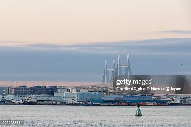 the first sunrise and tsurumi-tsubasa bridge. - tsubasa stock pictures, royalty-free photos & images