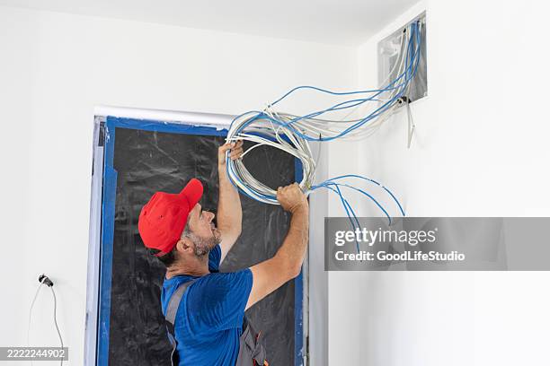 instaling cable tv and internet in a new house - cable tv stock pictures, royalty-free photos & images