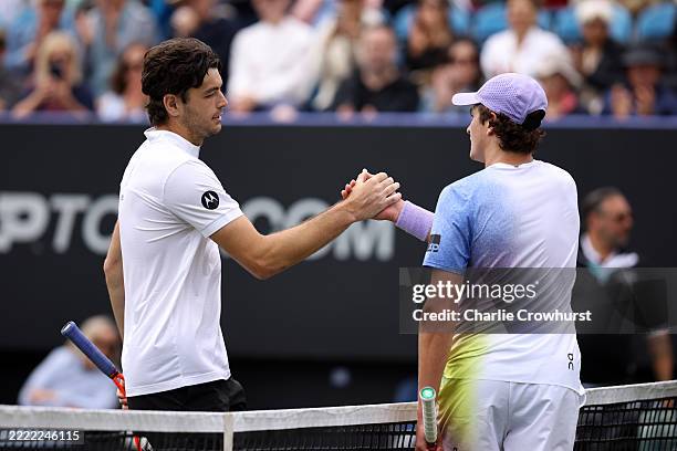 Taylor Fritz of United States shakes hands with Joao Fonseca of Brazil following the Men's Singles Second Round match on Day Four of the Lexus...