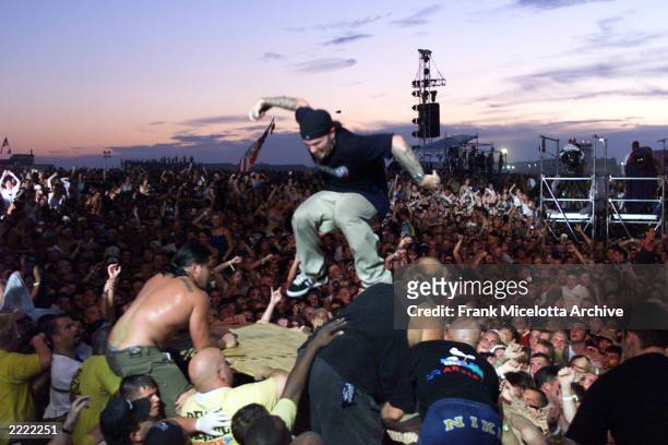 Limp Bizkit's Fred Durst brings his performance to the heads of the crowd of the east stage Saturday at Woodstock '99 in Rome, New York. Limp Bizkit...
