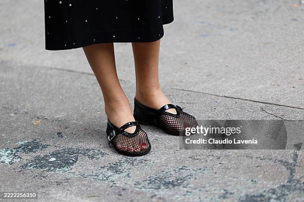 Guest wears black Alaïa ballet flats, outside Issey Miyake, during the Menswear Spring/Summer 2026 show as part of Paris Fashion Week on June 26,...