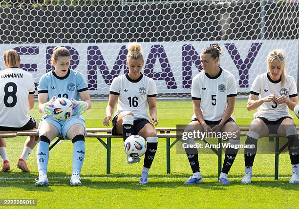 Goalkeeper Stina Johannes, Linda Dallmann, Carlotta Wamser and Kathrin Hendrich of Germany's National Women's team wait for a team photo ahead of the...