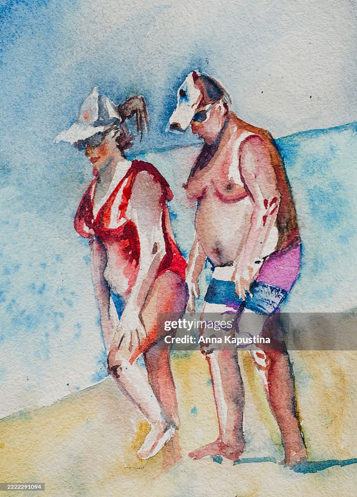 A couple of real people walking on the beach