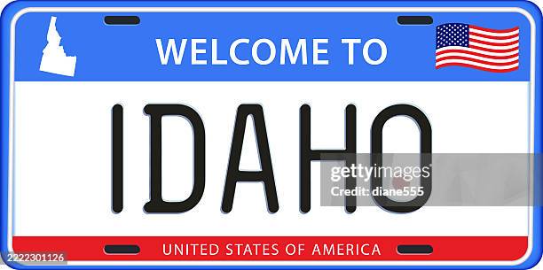 idaho license plate with map & flag - idaho stock illustrations