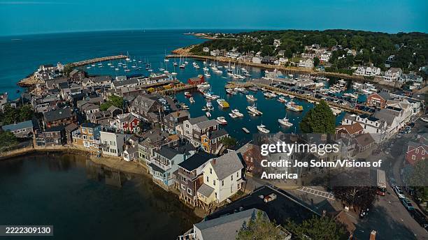 New England fishing village near Gloucester, Massachusetts, with New England homes and church spires.
