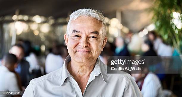 close-up of confident senior standing in cafe - sorriso discreto imagens e fotografias de stock