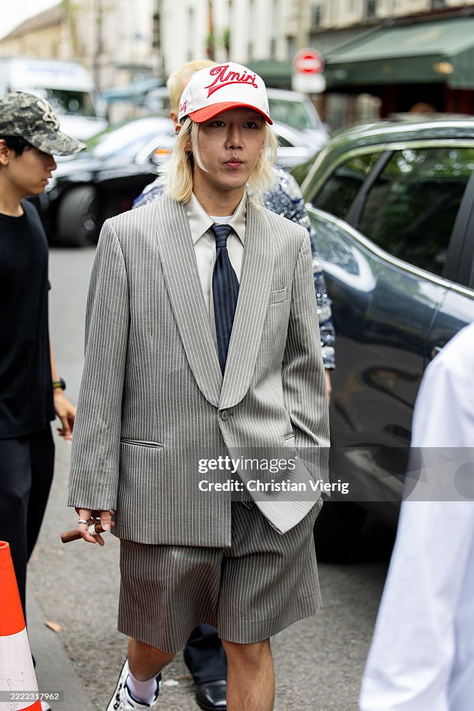 HWIMIN is seen wearing cap, grey blazer, shorts outside Amiri