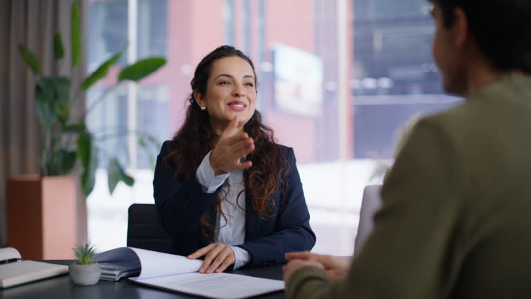 https://media.gettyimages.com/id/2222369265/video/smiling-sales-agent-talking-client-giving-pen-for-signing-at-office-portrait.jpg?b=1&s=640x640&k=20&c=vRAxyJNusOs6dd1soNfG0qBb3z3XoMNMP4Y6ASp7zBQ=