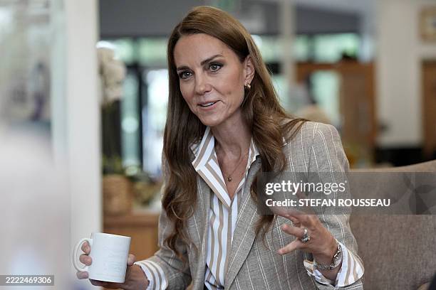 Britain's Catherine, Princess of Wales speaks during a visit to see the RHS Wellbeing Garden at Colchester Hospital in Essex, southeast England on...