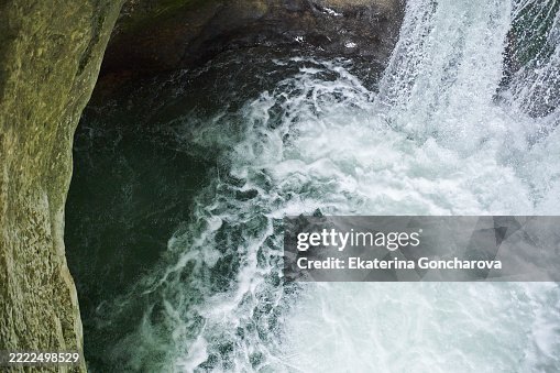 Dynamic Waterfall Flowing into a Rocky Stream Captured Closely in Nature Dynamic Waterfall Flowing into a Rocky Stream Captured Closely in Nature
