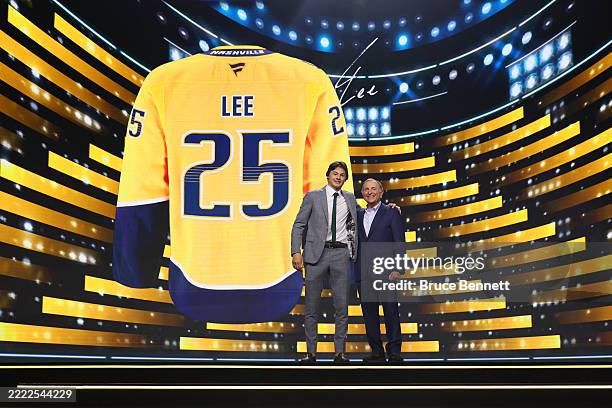 Ryker Lee poses with NHL commissioner Gary Bettman after being drafted by the Nashville Predators with the 26th overall pick during the first round...